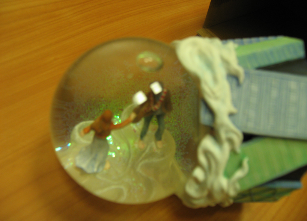 The figurine came off in the snow globe.